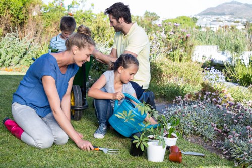 Gardener inspecting a client garden