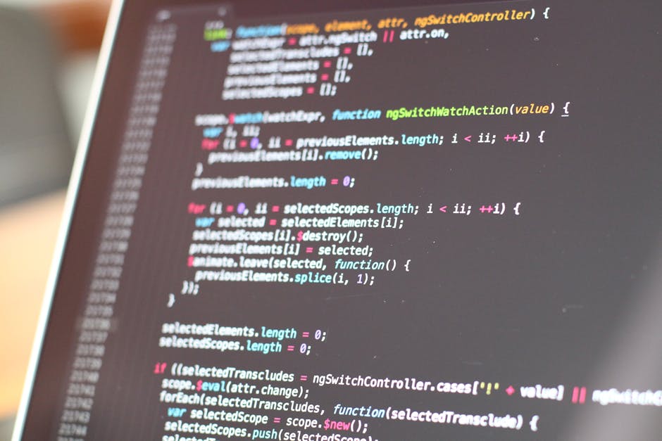 A close-up view of a computer screen displaying colorful lines of code, with various programming syntax highlighted in bright colors such as pink, green, blue, and yellow. The code appears to be JavaS